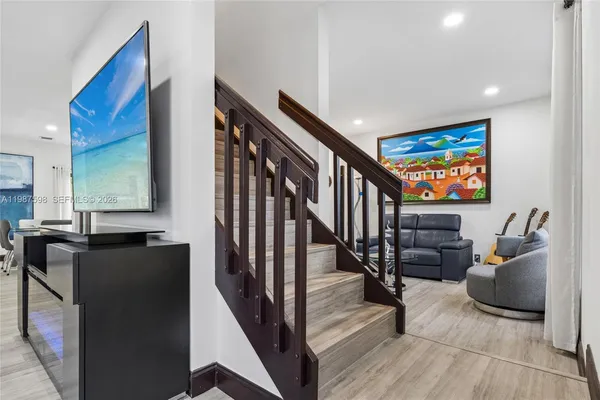 a view of a hallway with seating space and furniture