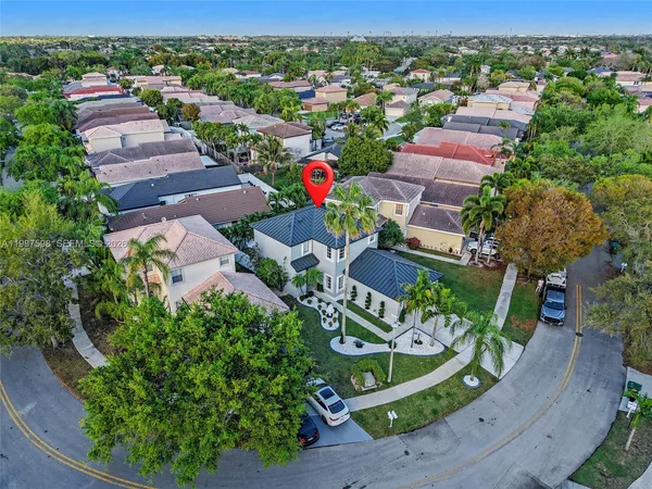 an aerial view of residential house with outdoor space and street view