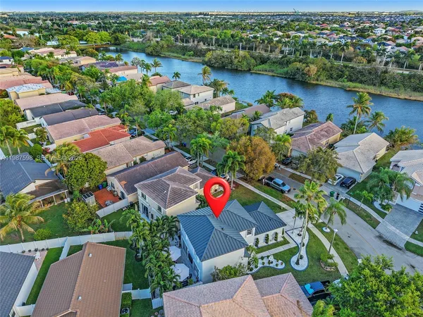 an aerial view of residential building and lake