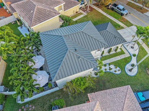a view of a chair and table with wooden fence