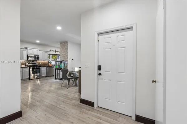 a view of a kitchen and dining room
