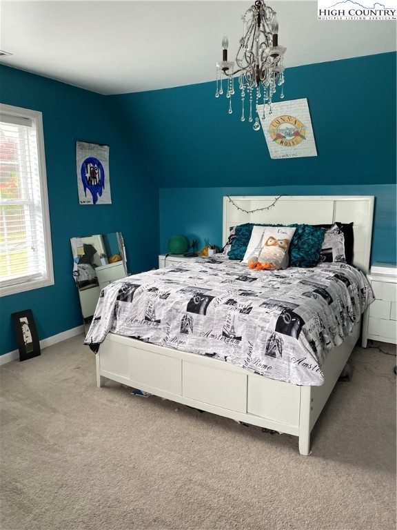 298 Russelton Road Boone, NC 28607 - Photo 13 of 28 a bedroom with a bed and a window