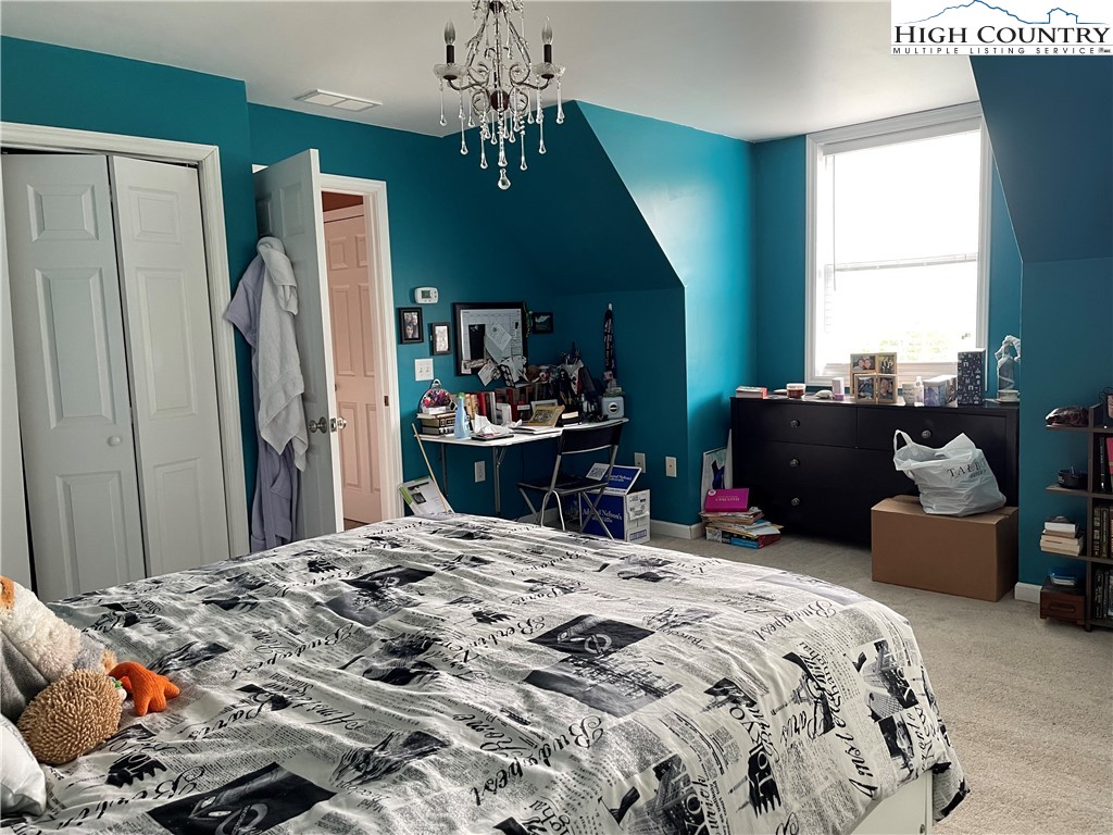 298 Russelton Road Boone, NC 28607 - Photo 14 of 28 a bedroom with bed and a window