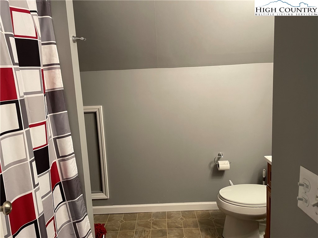298 Russelton Road Boone, NC 28607 - Photo 16 of 28 a bathroom with a toilet and a shower