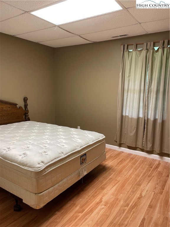 298 Russelton Road Boone, NC 28607 - Photo 22 of 28 a bed sitting in a bedroom next to a window