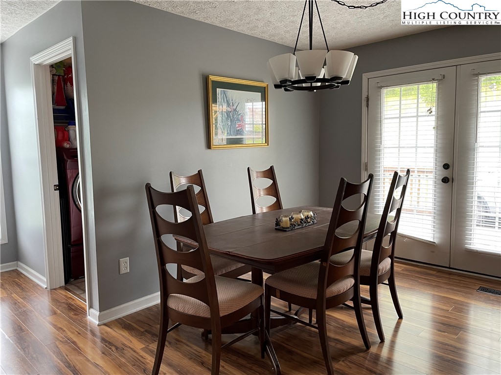 298 Russelton Road Boone, NC 28607 - Photo 5 of 28 a view of a dining room with furniture window and wooden floor