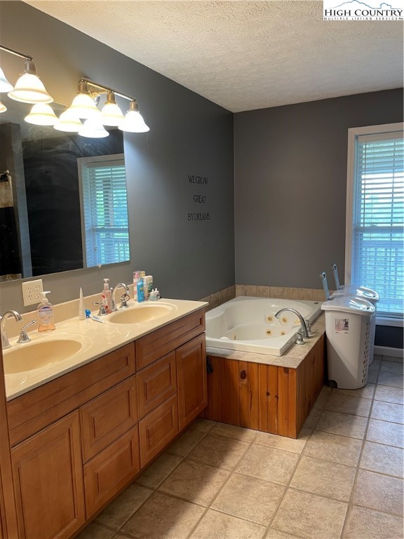 298 Russelton Road Boone, NC 28607 - Photo 9 of 28 a bathroom with a sink double vanity and a bathtub