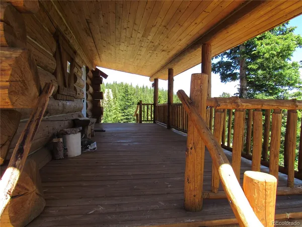 a view of deck with wooden floor and outdoor seating