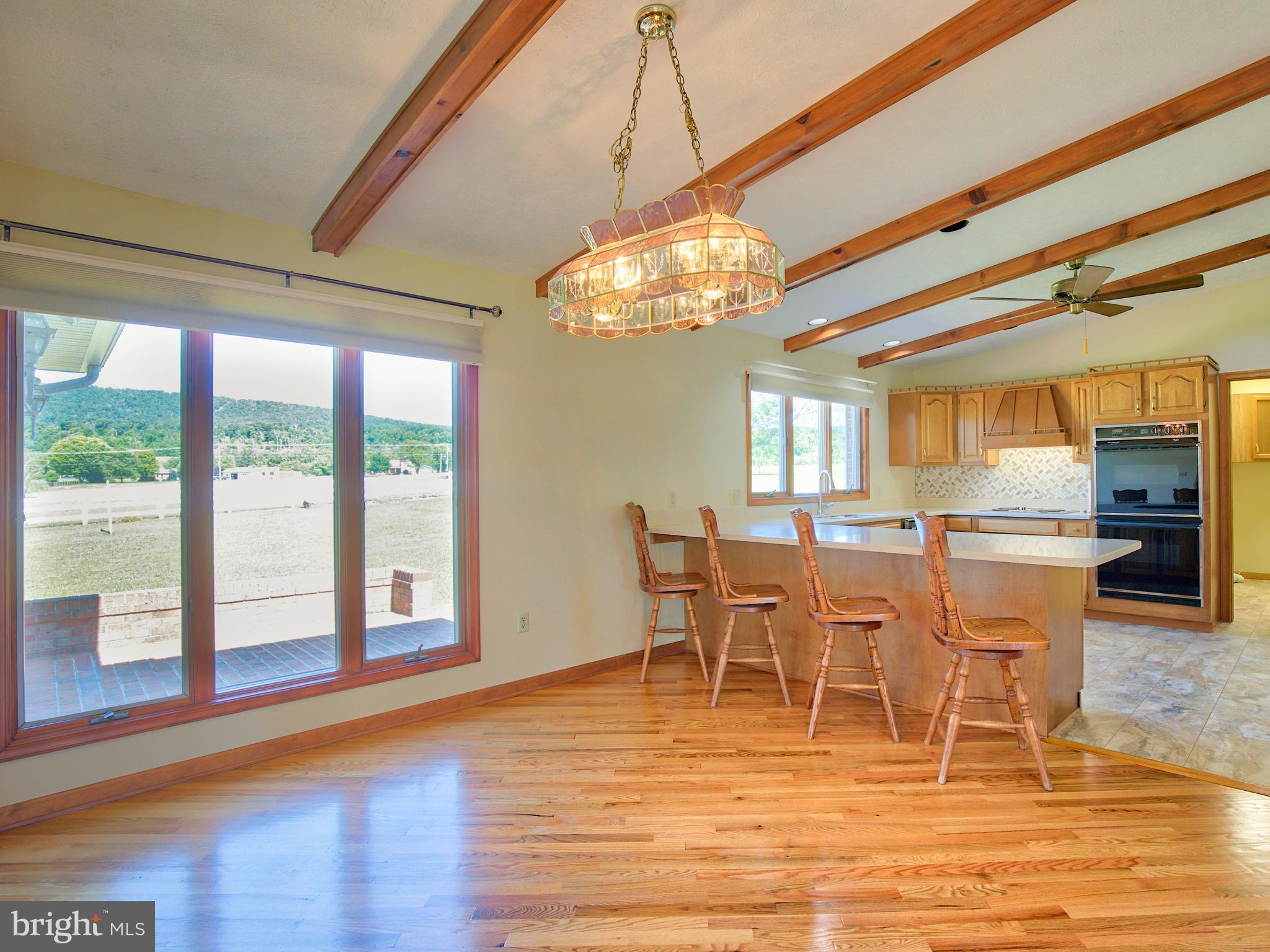 210 Hanging Tree Road Winchester, VA 22603 - Photo 7 of 50 Large windows let the view show in the Dining Area