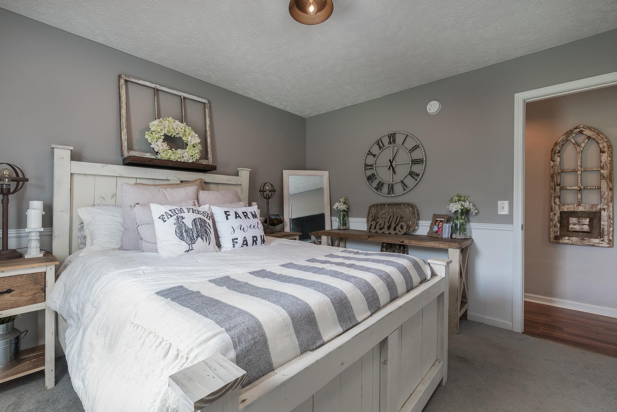 2964 Riley Creek Road Normandy, TN 37360 - Photo 11 of 18 a bedroom with bed and painting on the wall