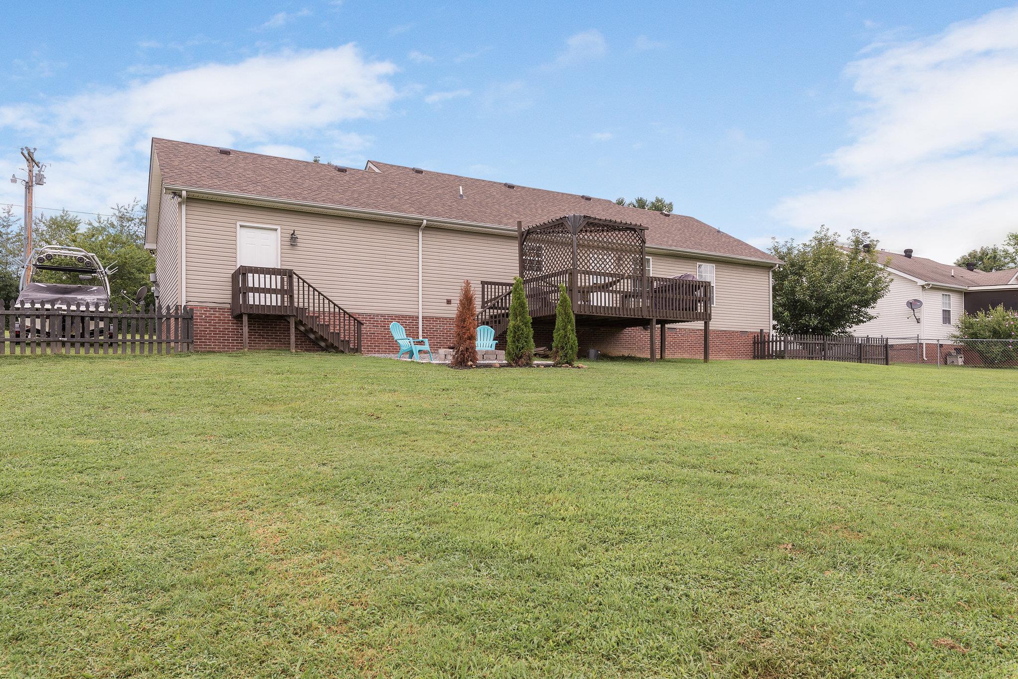 2964 Riley Creek Road Normandy, TN 37360 - Photo 16 of 18 a view of a house with a big yard and large trees