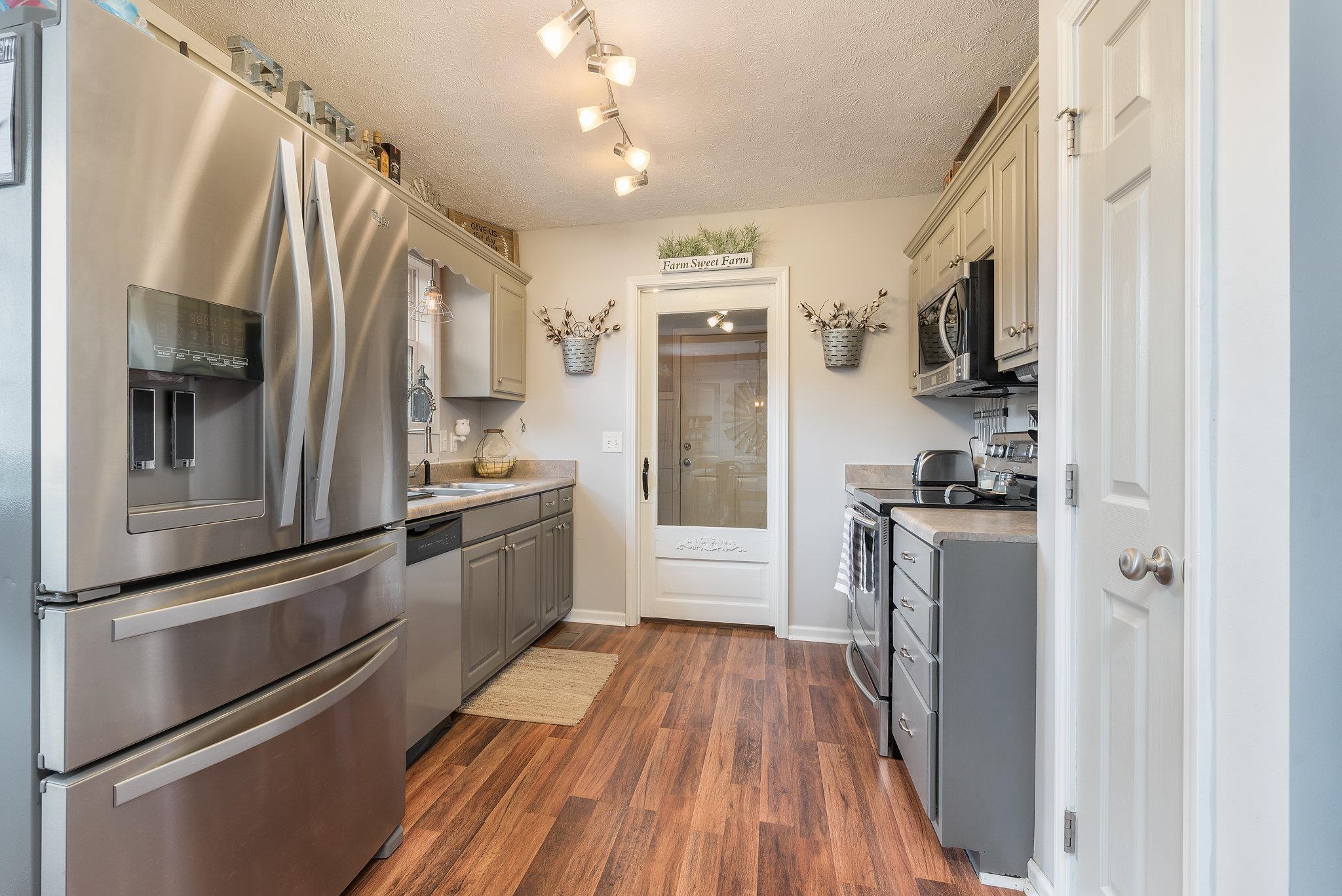 2964 Riley Creek Road Normandy, TN 37360 - Photo 4 of 18 a kitchen with stainless steel appliances a refrigerator sink and microwave