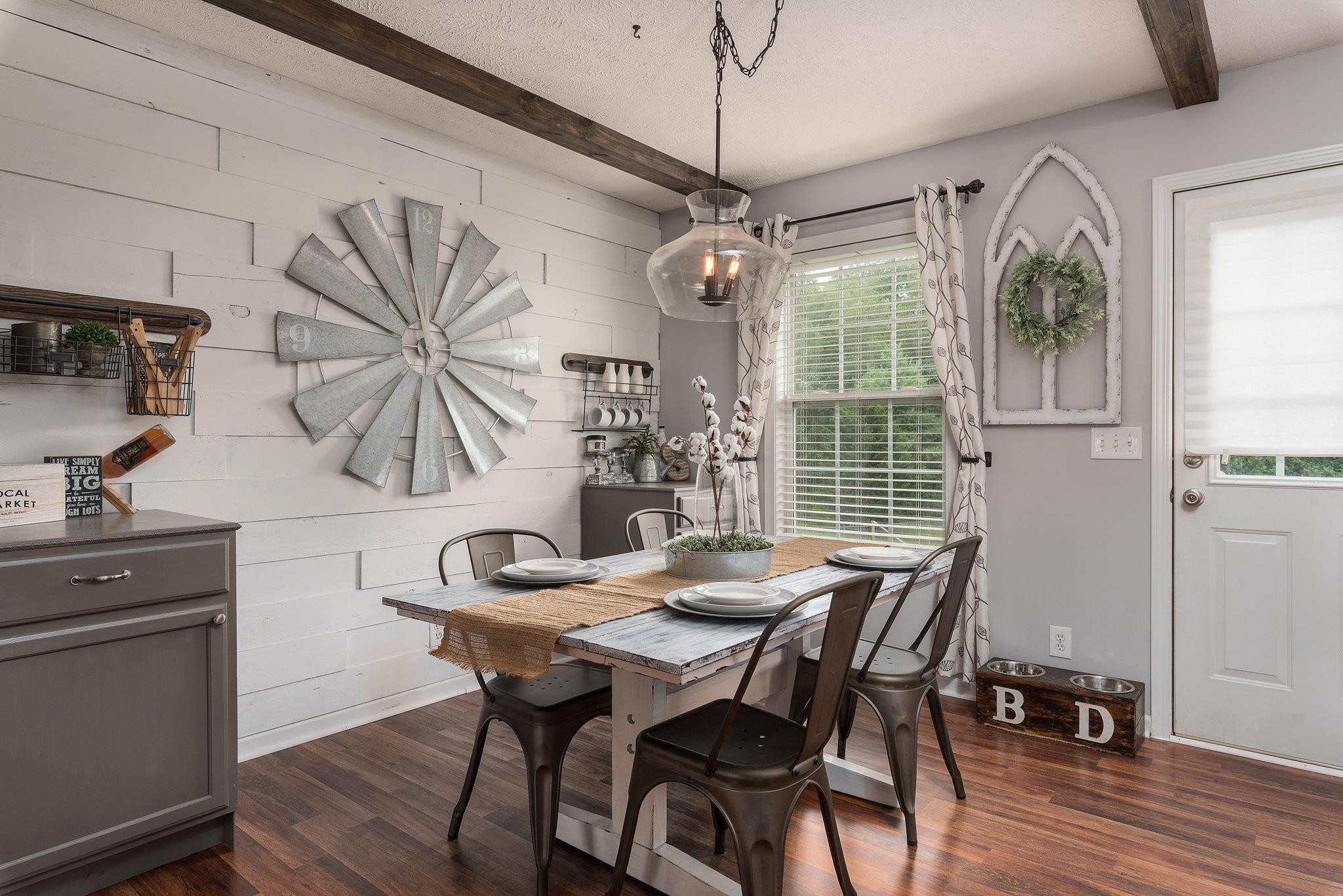 2964 Riley Creek Road Normandy, TN 37360 - Photo 6 of 18 a dining room with furniture a chandelier and wooden floor