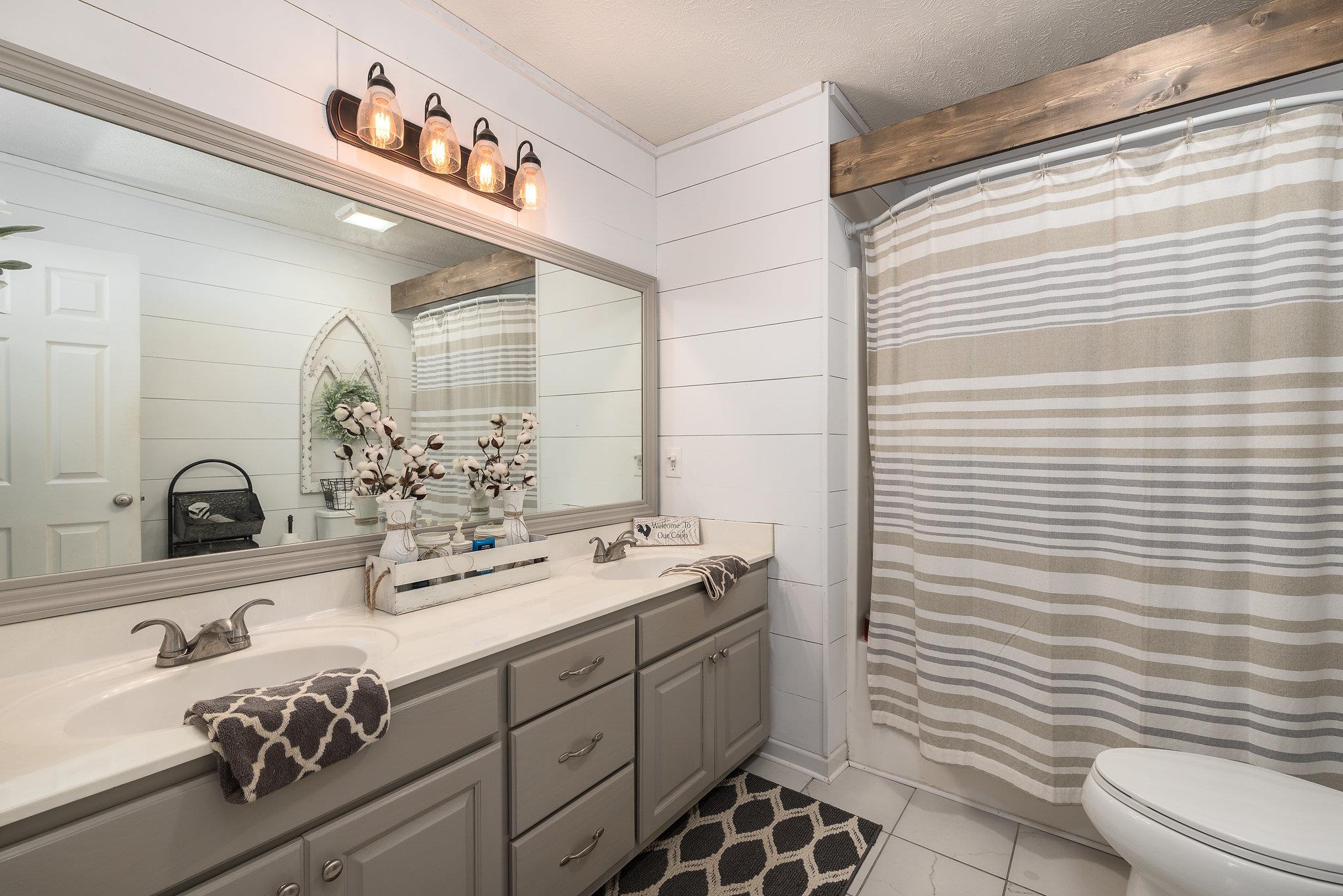 2964 Riley Creek Road Normandy, TN 37360 - Photo 10 of 18 a bathroom with a sink and a mirror