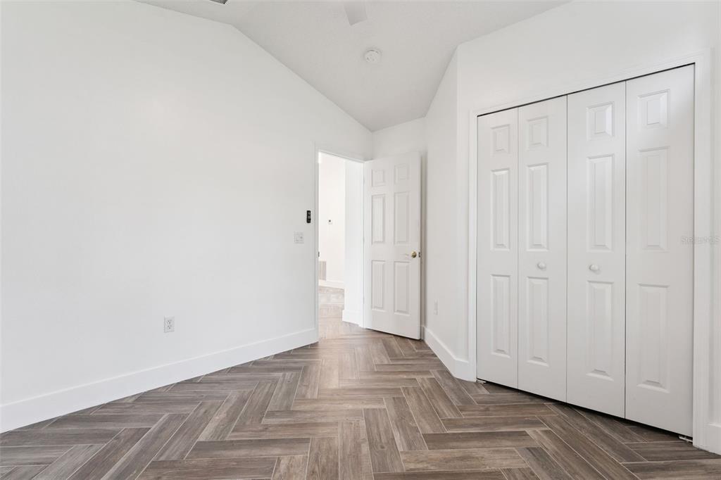 655 Eagle Pointe South Kissimmee, FL 34746 - Photo 16 of 49 a view of a hallway with wooden floor
