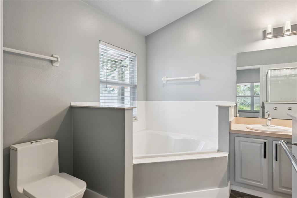 655 Eagle Pointe South Kissimmee, FL 34746 - Photo 26 of 49 a white toilet sitting next to a bathroom sink