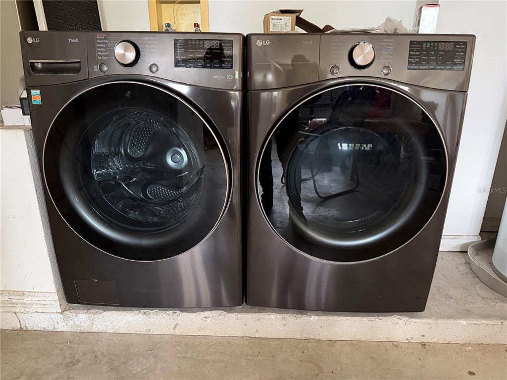655 Eagle Pointe South Kissimmee, FL 34746 - Photo 48 of 49 a close up view of a washer and dryer in a utility room
