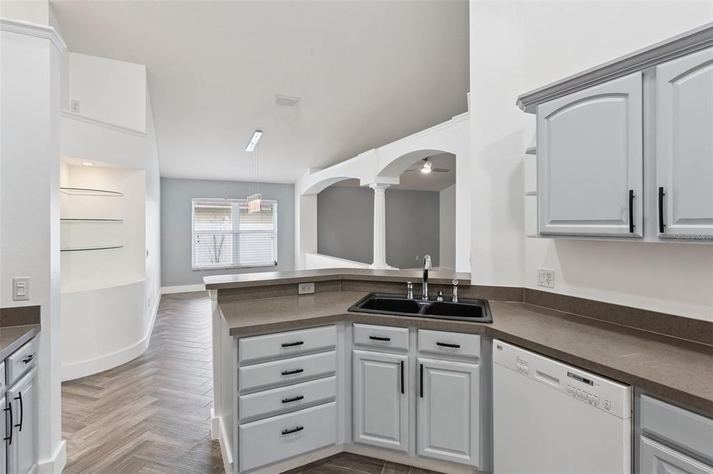 655 Eagle Pointe South Kissimmee, FL 34746 - Photo 8 of 49 a bathroom with a granite countertop sink a large mirror and a