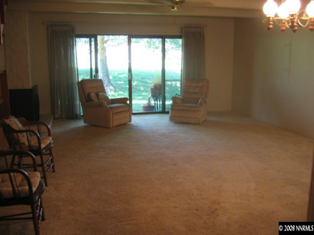1917 South Villa Way Reno, NV 89509 - Photo 4 of 9 a living room with furniture and a floor to ceiling window