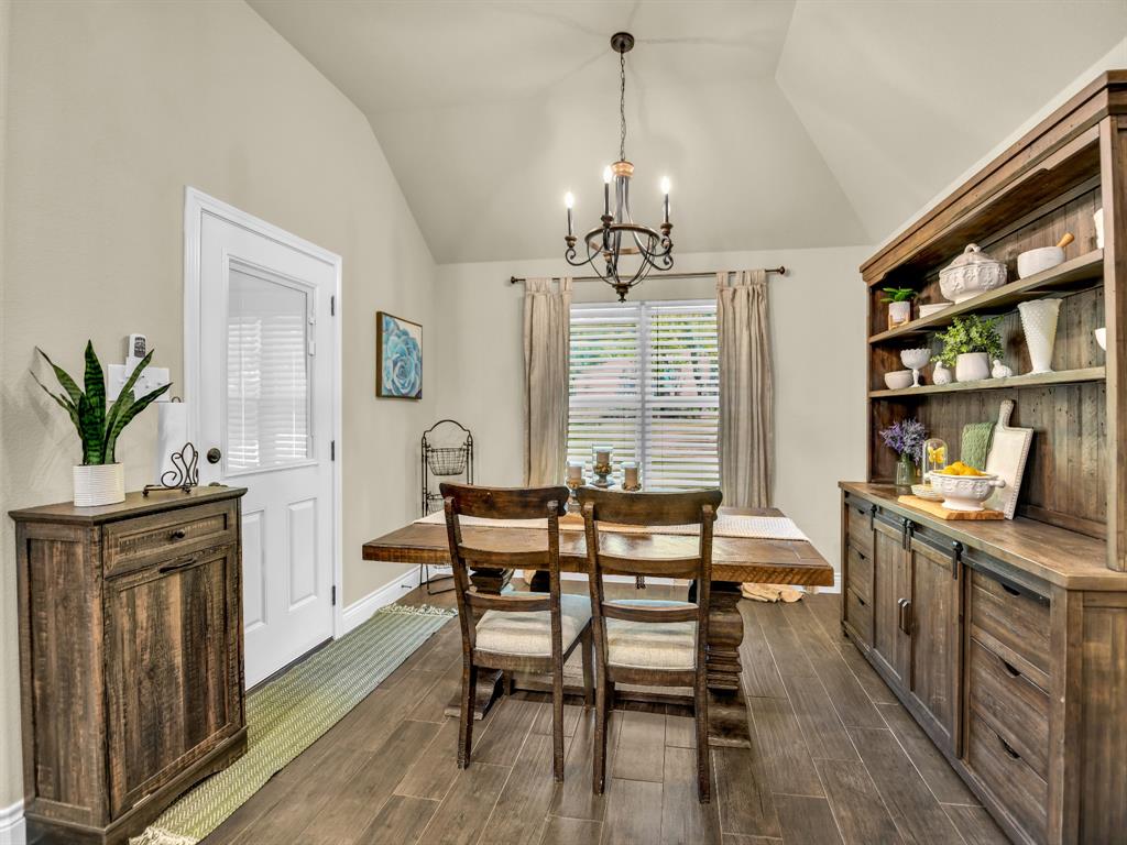 156 Cottongame Road Weatherford, TX 76088 - Photo 14 of 35 a view of a dining room with furniture window and wooden floor