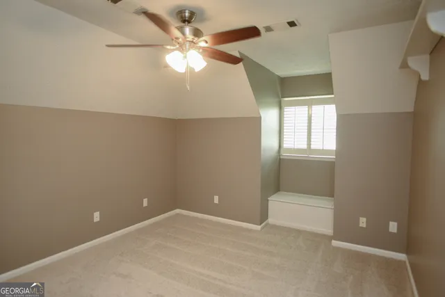 an empty room with wooden floor