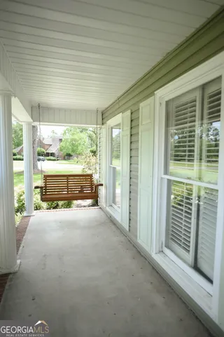 a view of an empty room with a balcony