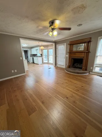 an empty room with wooden floor