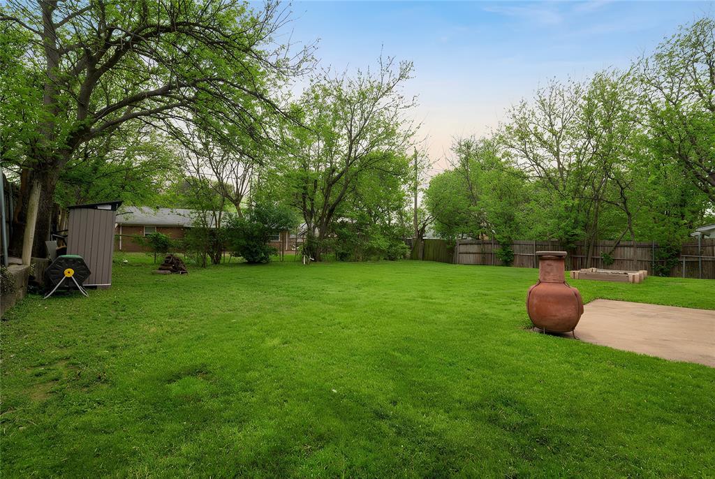6020 Harrison Way Watauga, TX 76148 - Photo 7 of 32 View of fenced backyard