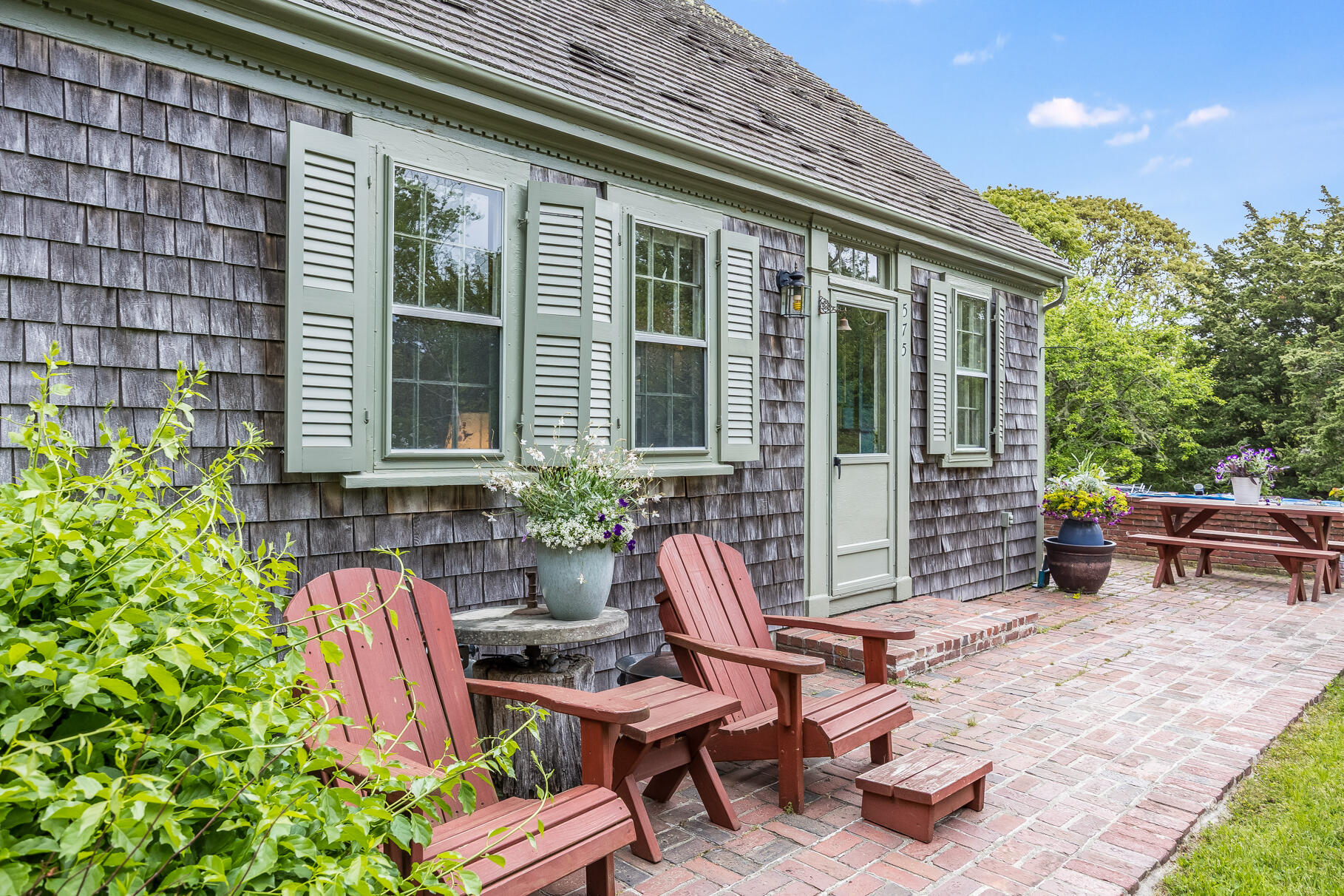 575 Nauset Road Eastham, MA 02642 - Photo 16 of 68 a view of a two chairs in the patio