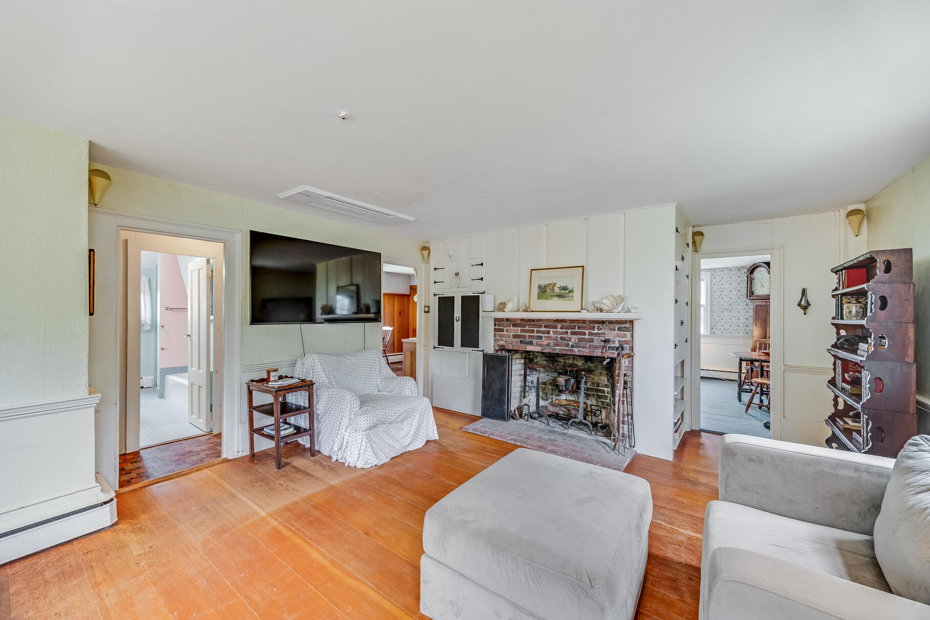 575 Nauset Road Eastham, MA 02642 - Photo 25 of 68 a living room with fireplace furniture and a flat screen tv