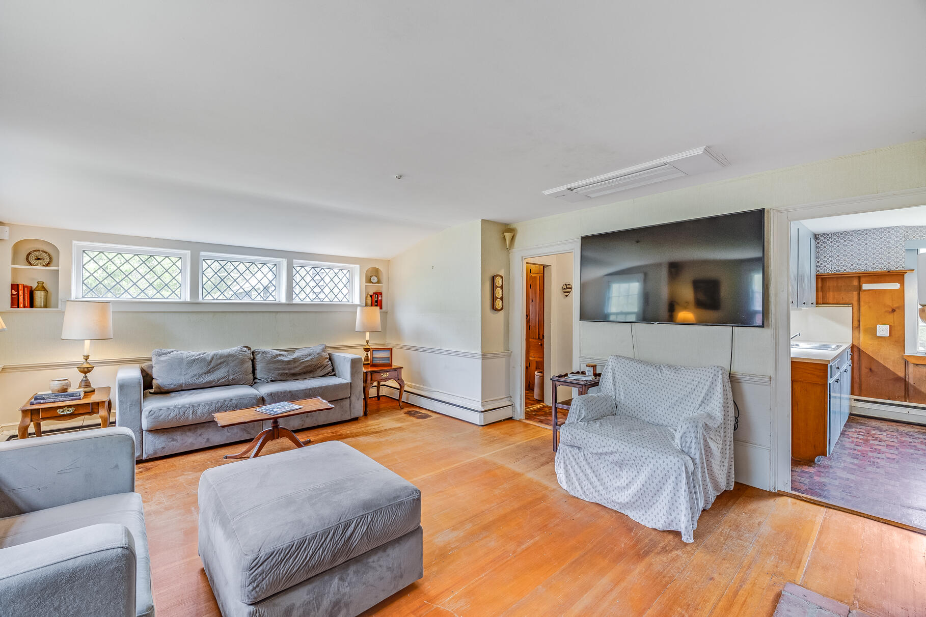 575 Nauset Road Eastham, MA 02642 - Photo 26 of 68 a living room with furniture and a wooden floor