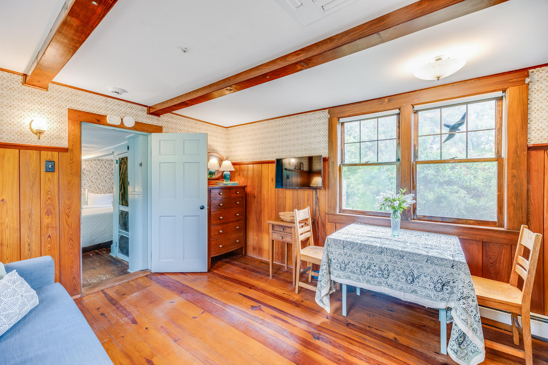 575 Nauset Road Eastham, MA 02642 - Photo 36 of 68 a bedroom with a bed and a dresser next to a window