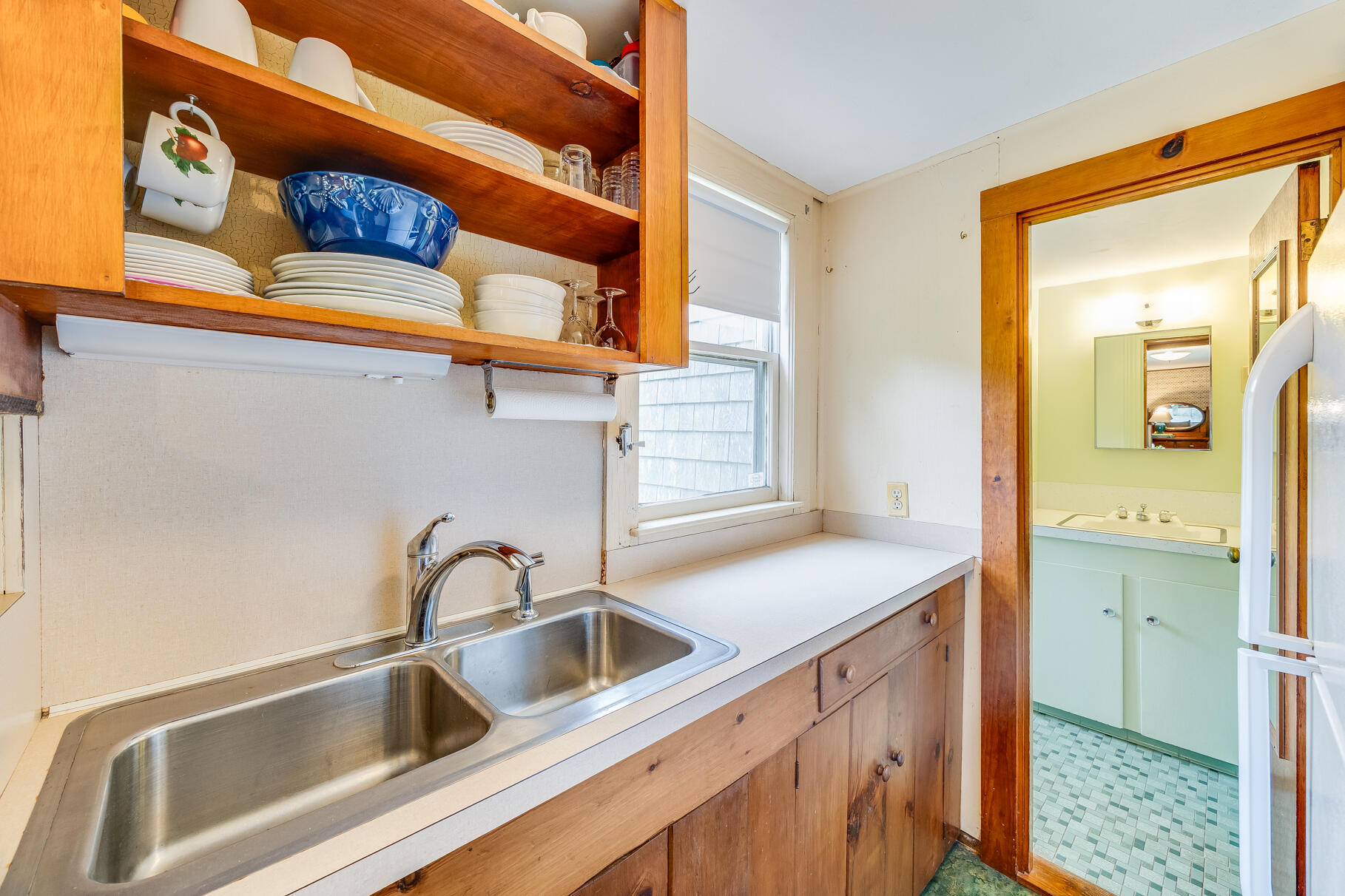 575 Nauset Road Eastham, MA 02642 - Photo 38 of 68 a kitchen with a sink and a refrigerator