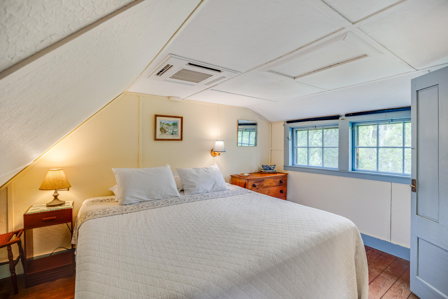 575 Nauset Road Eastham, MA 02642 - Photo 57 of 68 a bedroom with a bed and wooden floor