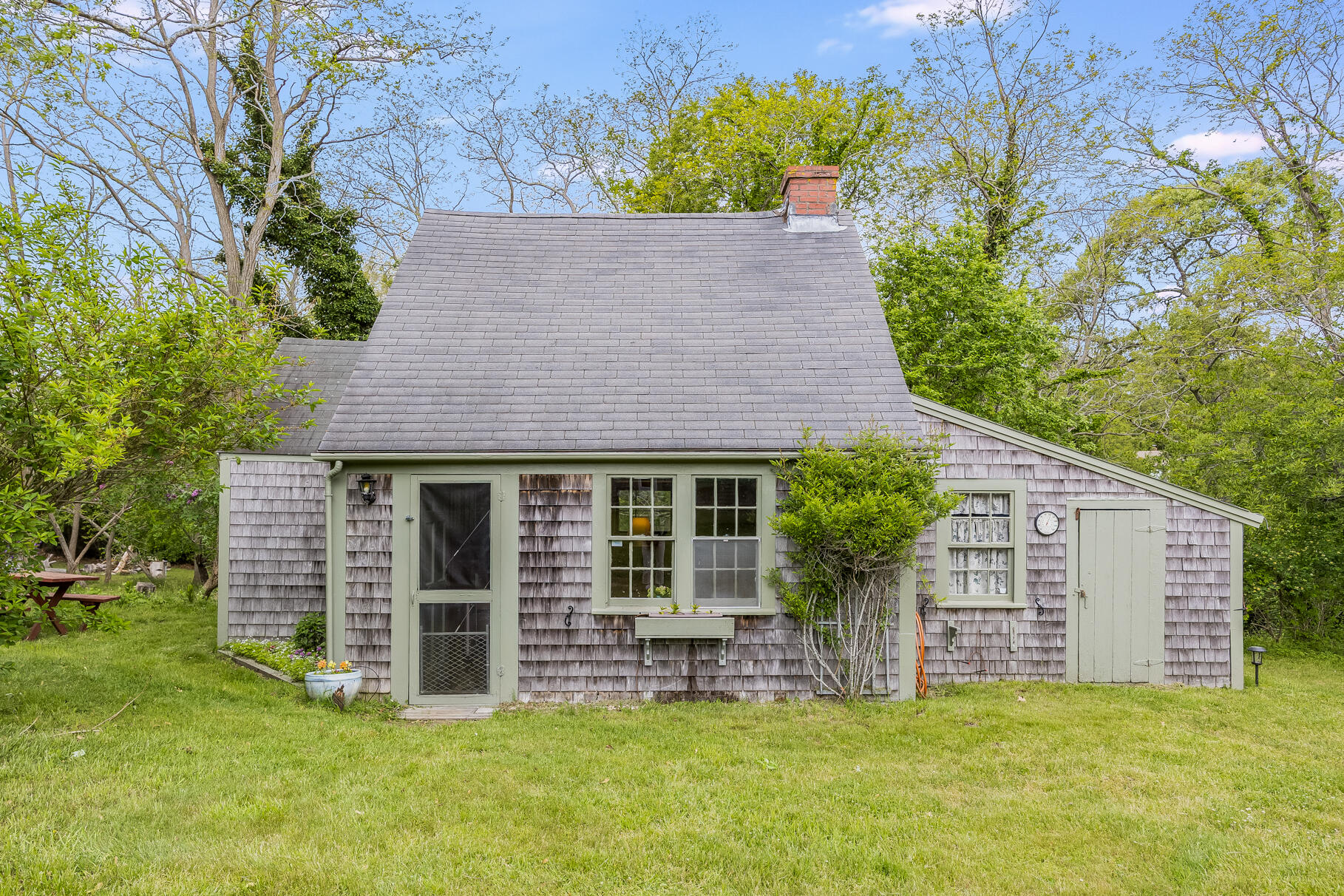 575 Nauset Road Eastham, MA 02642 - Photo 7 of 68 a house with a tree in front of it