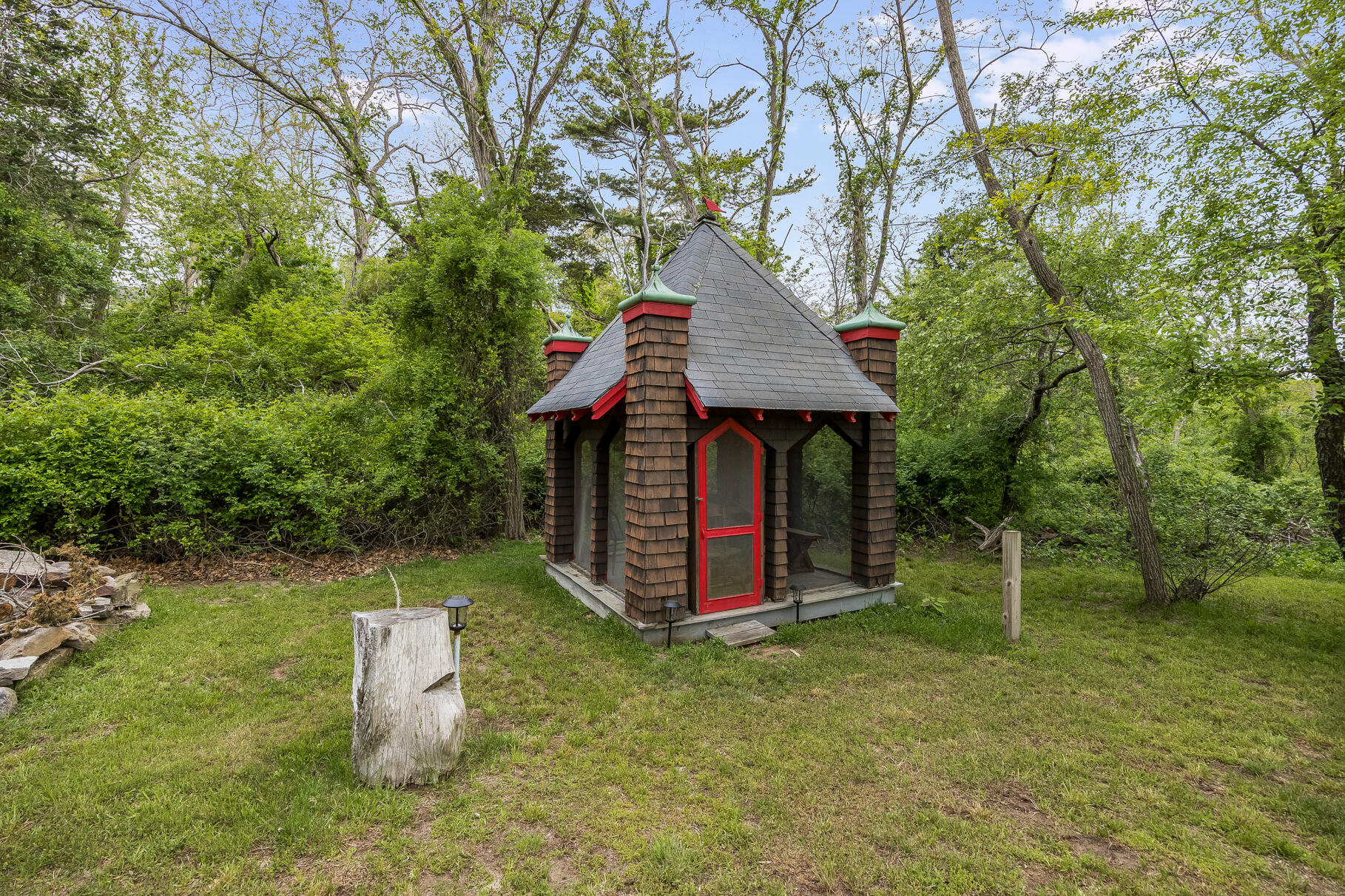 575 Nauset Road Eastham, MA 02642 - Photo 8 of 68 a view of a chair and table on the wooden deck