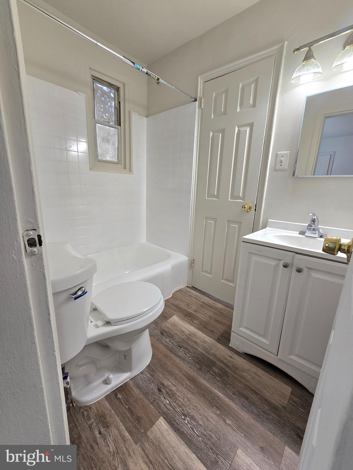 272 56th Street Northeast Washington, DC 20019 - Photo 13 of 13 a bathroom with a sink and a mirror