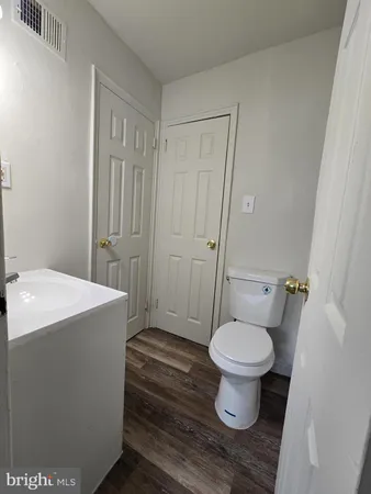 a bathroom with a toilet and a bathtub