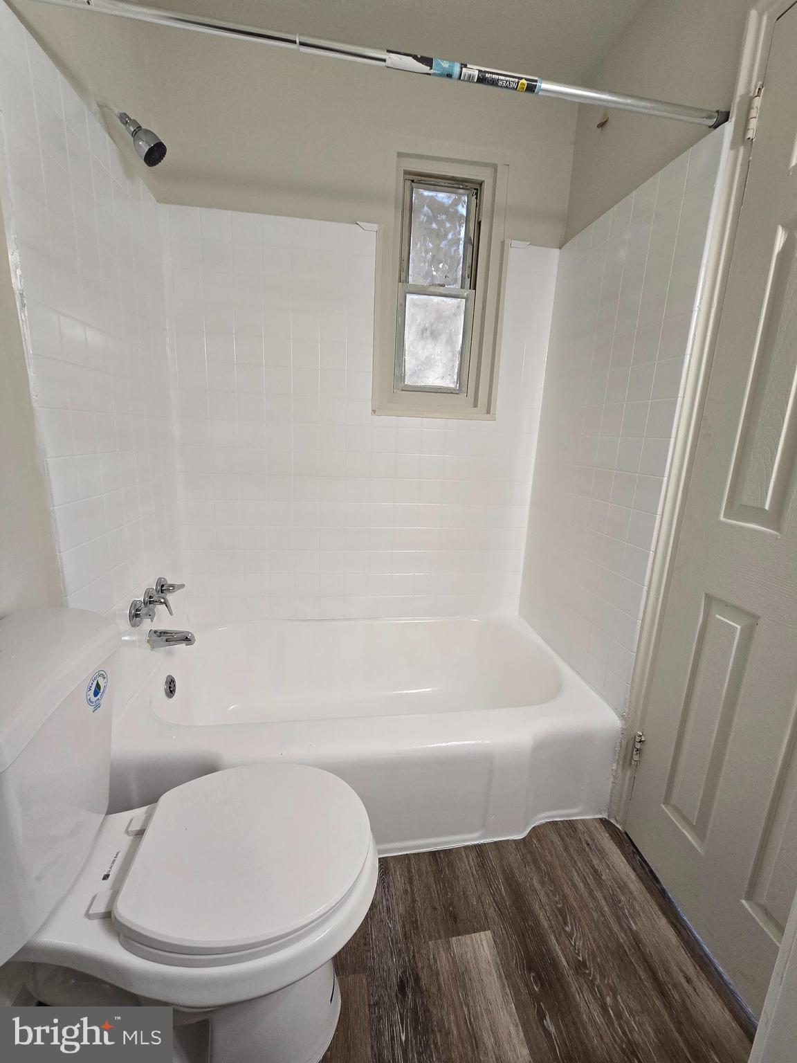 272 56th Street Northeast Washington, DC 20019 - Photo 10 of 13 a bathroom with a toilet and a bathtub