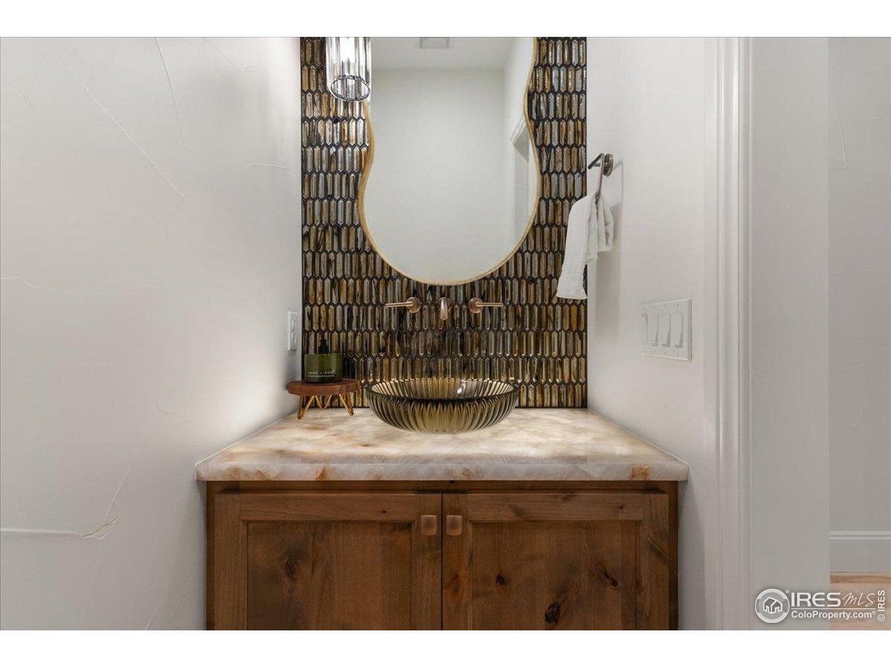 2805 Potomac Court Berthoud, CO 80513 - Photo 36 of 50 Half Bath with Stylish Underlit Counter
