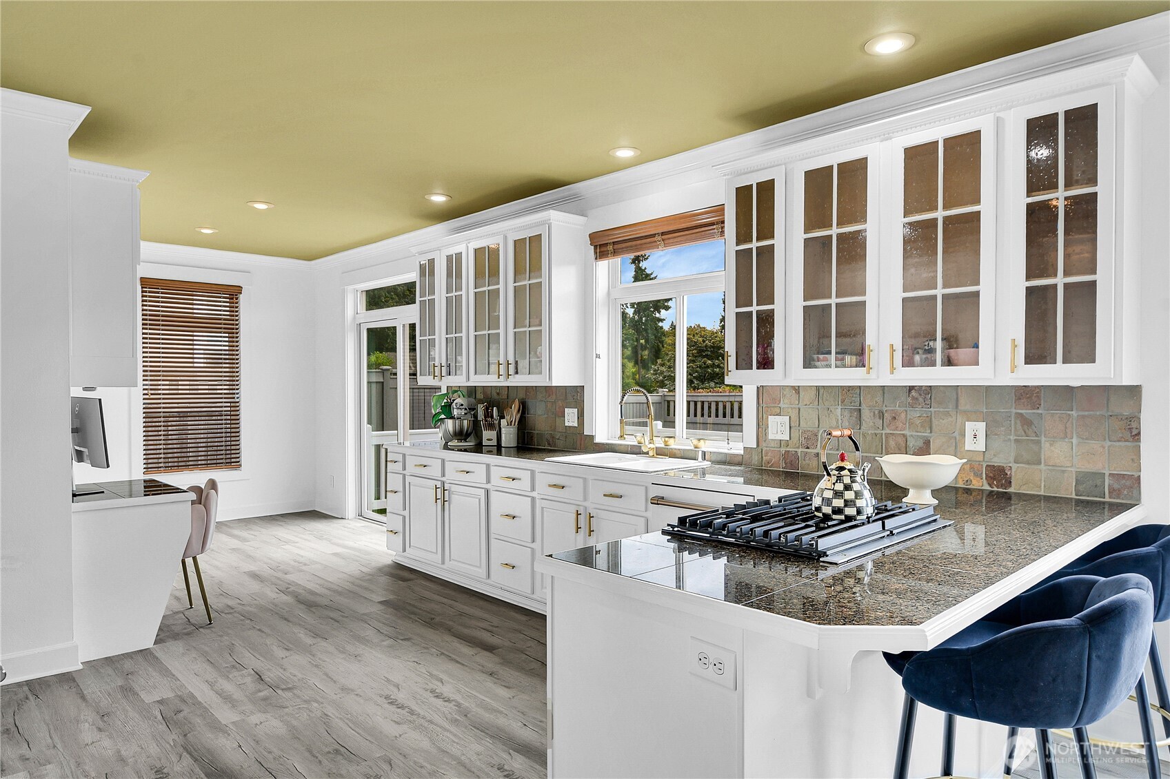 1011 North 27th Place Renton, WA 98056 - Photo 12 of 40 a kitchen with a sink cabinets and window