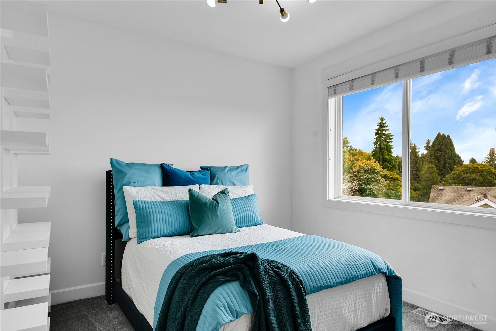 1011 North 27th Place Renton, WA 98056 - Photo 26 of 40 a bedroom with a bed and a window