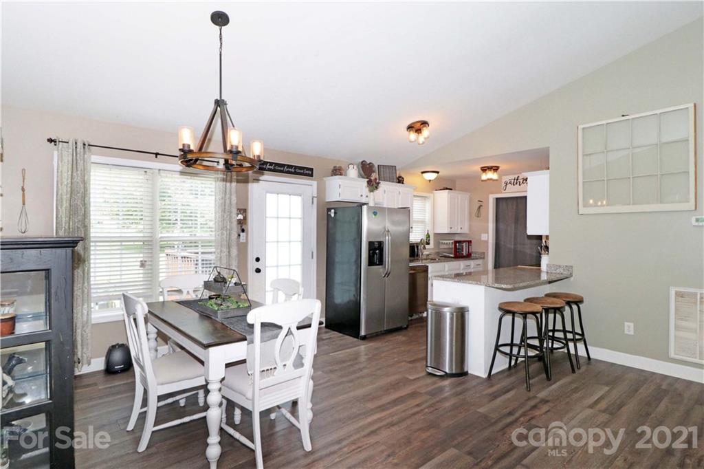 1045 Tabor Road Olin, NC 28660 - Photo 15 of 44 a dining room with furniture and window