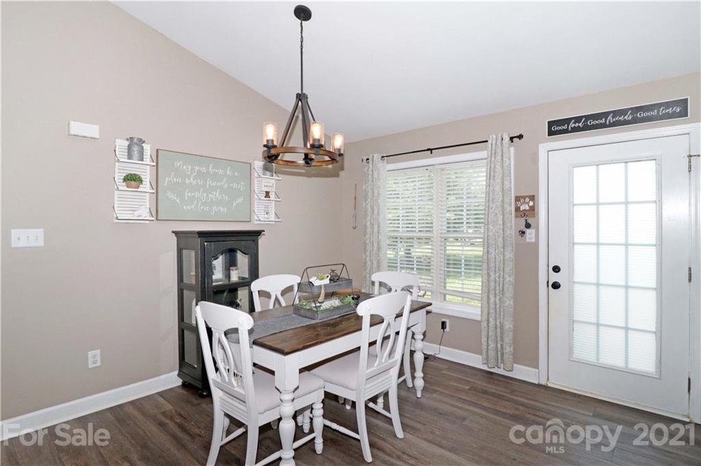 1045 Tabor Road Olin, NC 28660 - Photo 16 of 44 a view of a dining room with furniture window and outside view