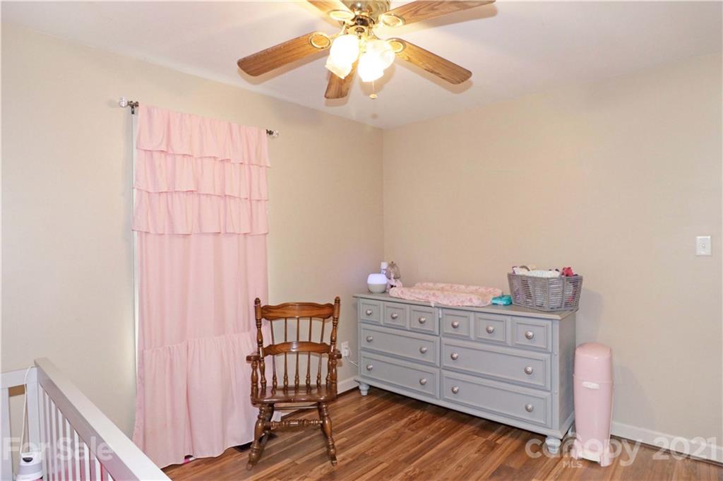 1045 Tabor Road Olin, NC 28660 - Photo 24 of 44 a room with stairs and furniture