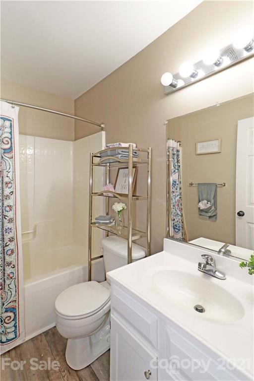1045 Tabor Road Olin, NC 28660 - Photo 26 of 44 a bathroom with a sink toilet and shower