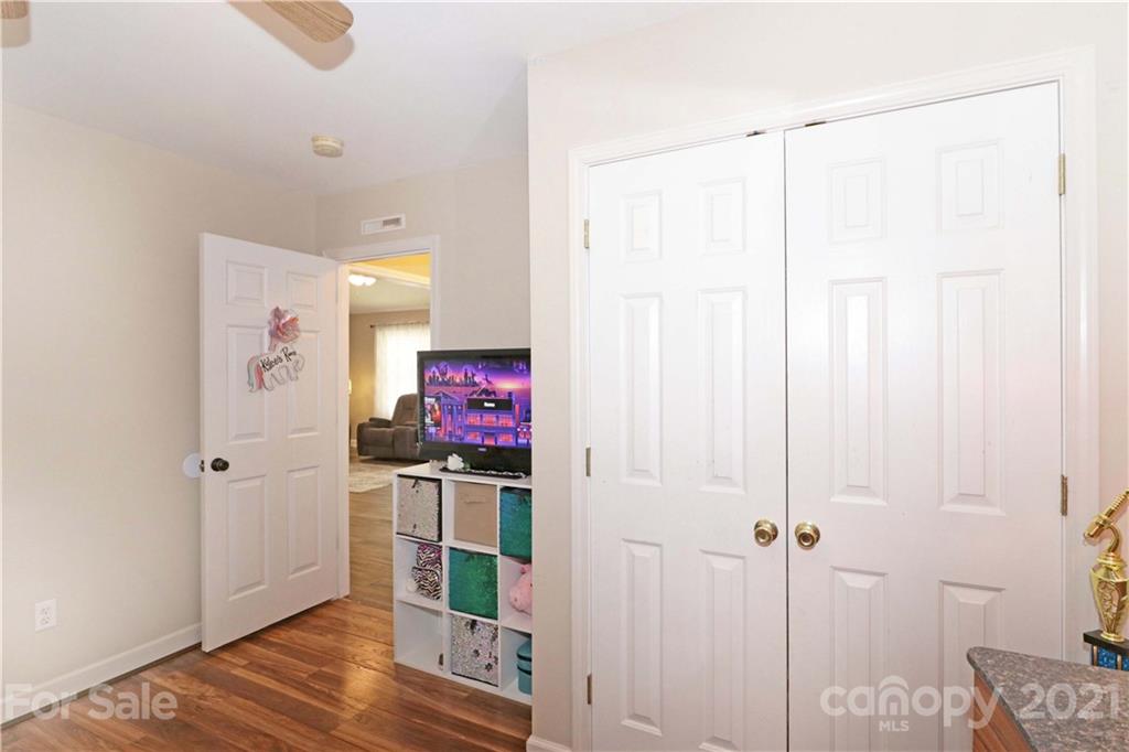 1045 Tabor Road Olin, NC 28660 - Photo 28 of 44 a view of a hallway with wooden floor and closet