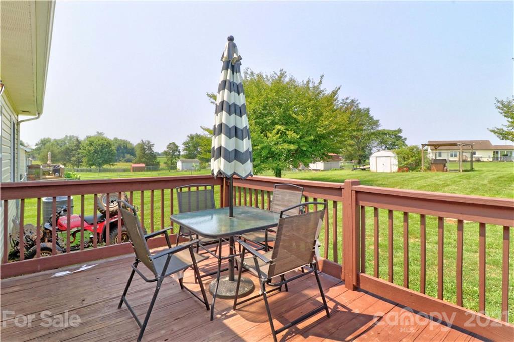 1045 Tabor Road Olin, NC 28660 - Photo 29 of 44 a view of a chair and table in the balcony