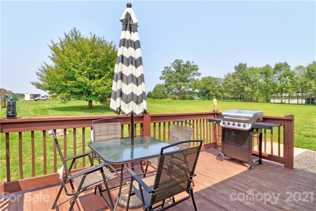 1045 Tabor Road Olin, NC 28660 - Photo 30 of 44 a view of a chairs and table on the deck