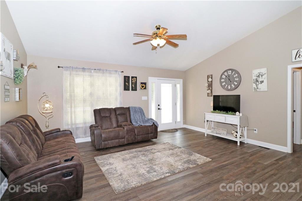 1045 Tabor Road Olin, NC 28660 - Photo 4 of 44 a living room with furniture and a window